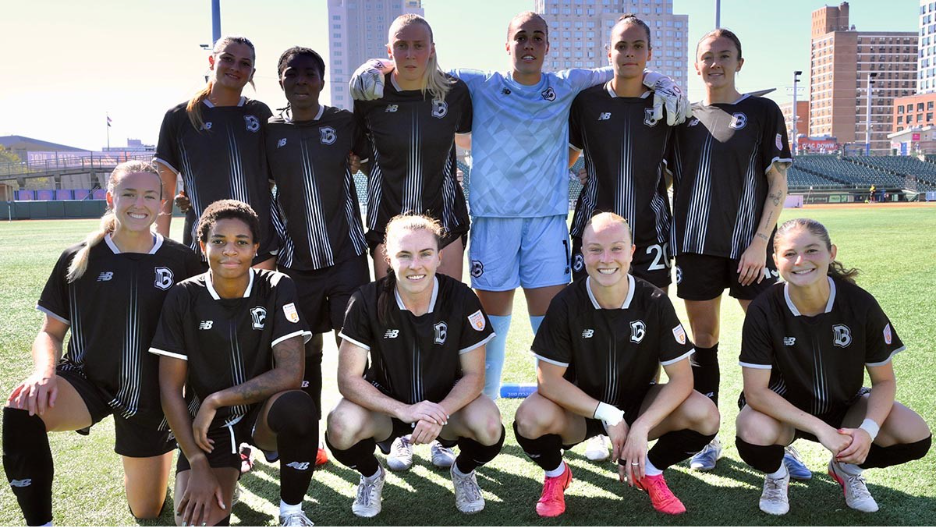 Brooklyn FC's Starting XI from a previous match showcasing their home kits.